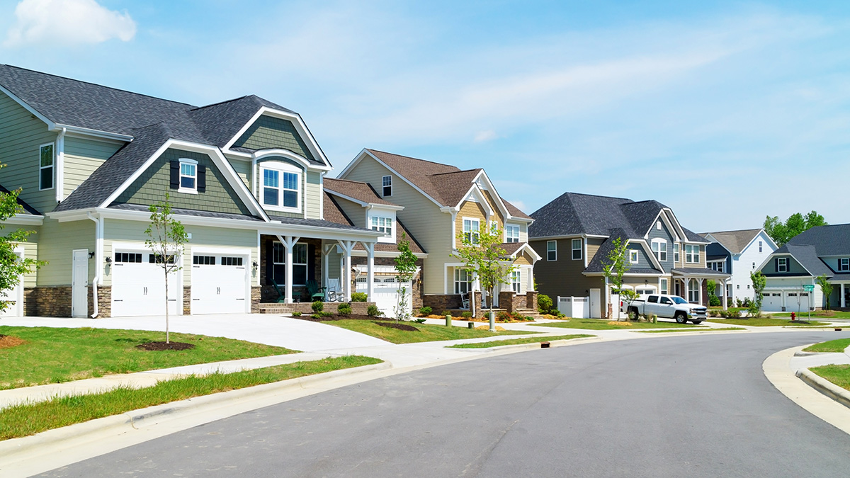 Suburban homes under blue skies
